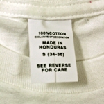 Hand Graded Irregular T-Shirt with Vertically Clipped Generic Care Label